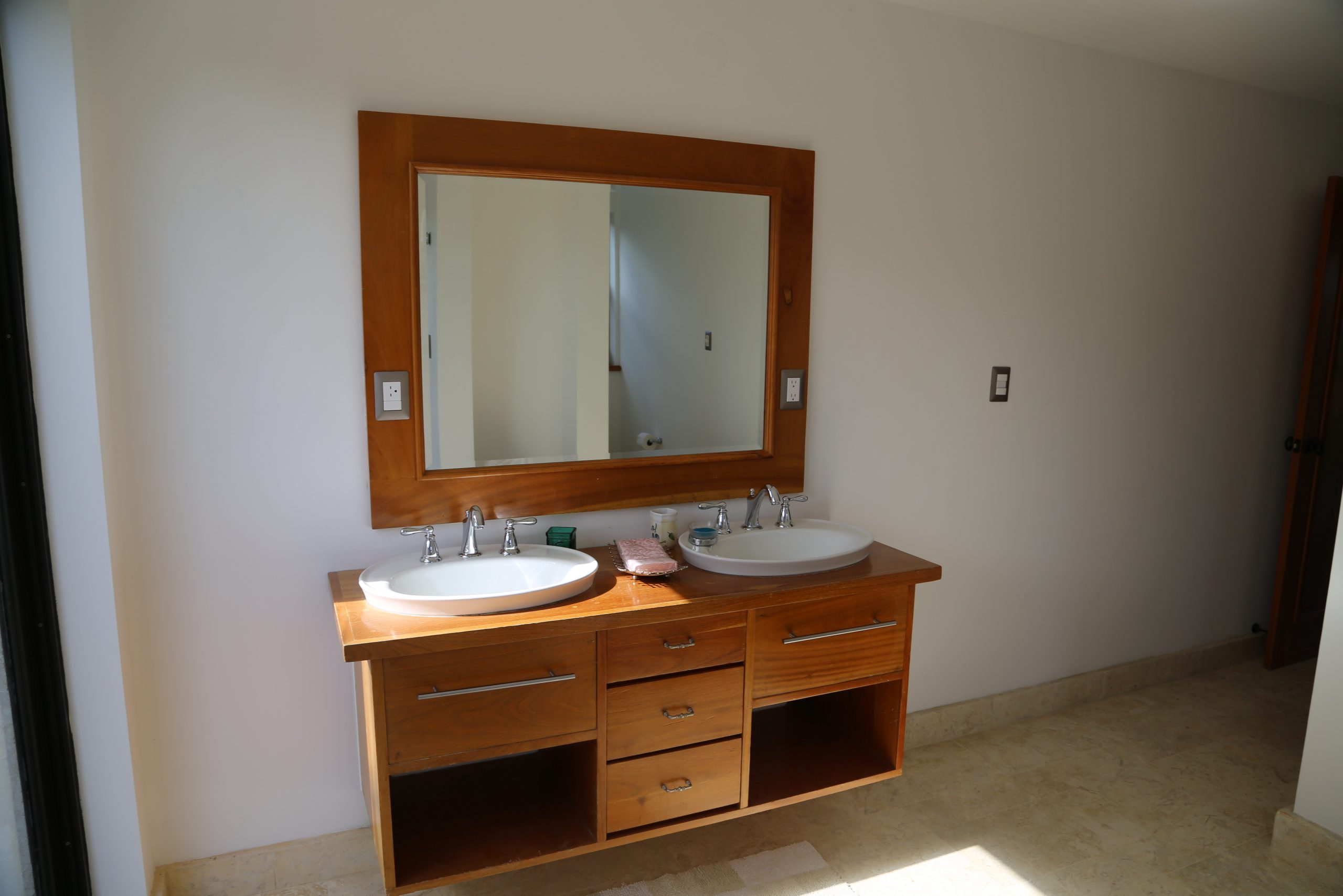 buyDRproperty Wooden bathroom vanity with double sinks and large mirror, bathroom design Sosua Real Estate