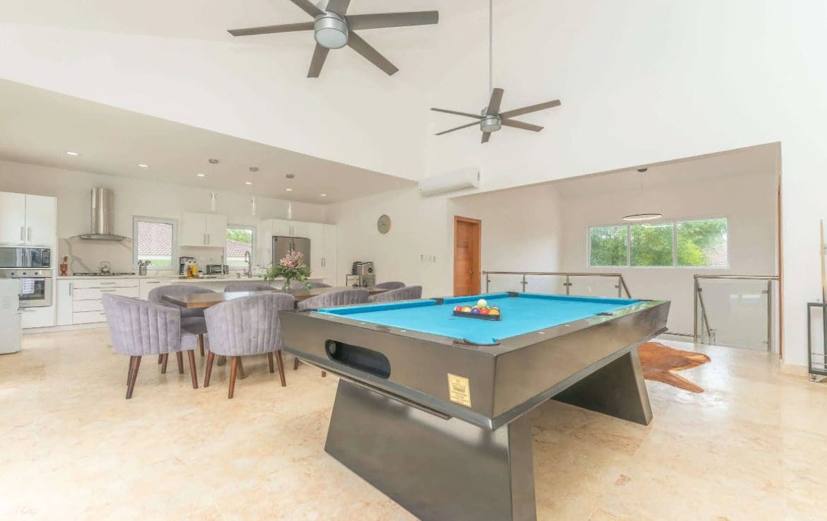 buyDRproperty open plan living room dining room with pooltable. Sosua Real Estate