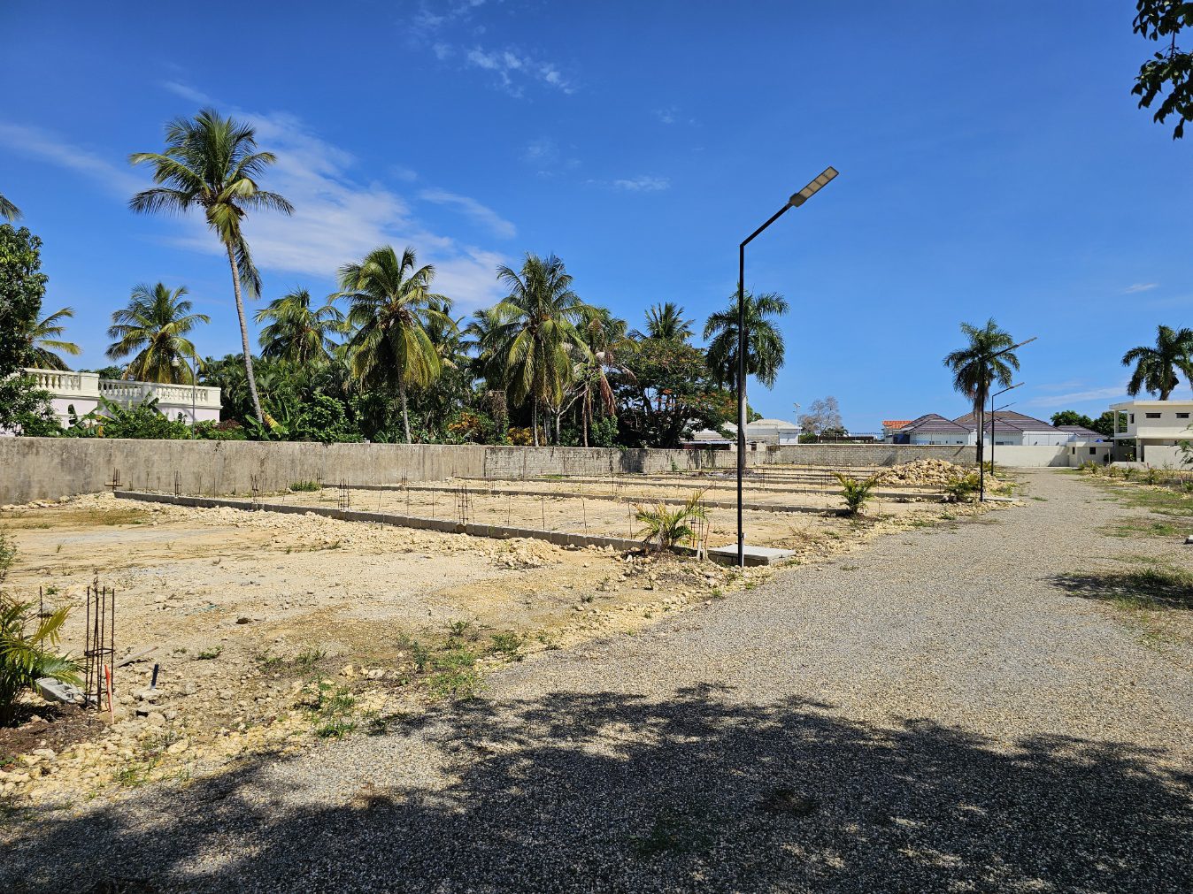 Buydrproperty Construction Site with Foundations Palm Trees and a Blue Sky Sosua Real Estate Buydrpropertycom Buydrpropertycom