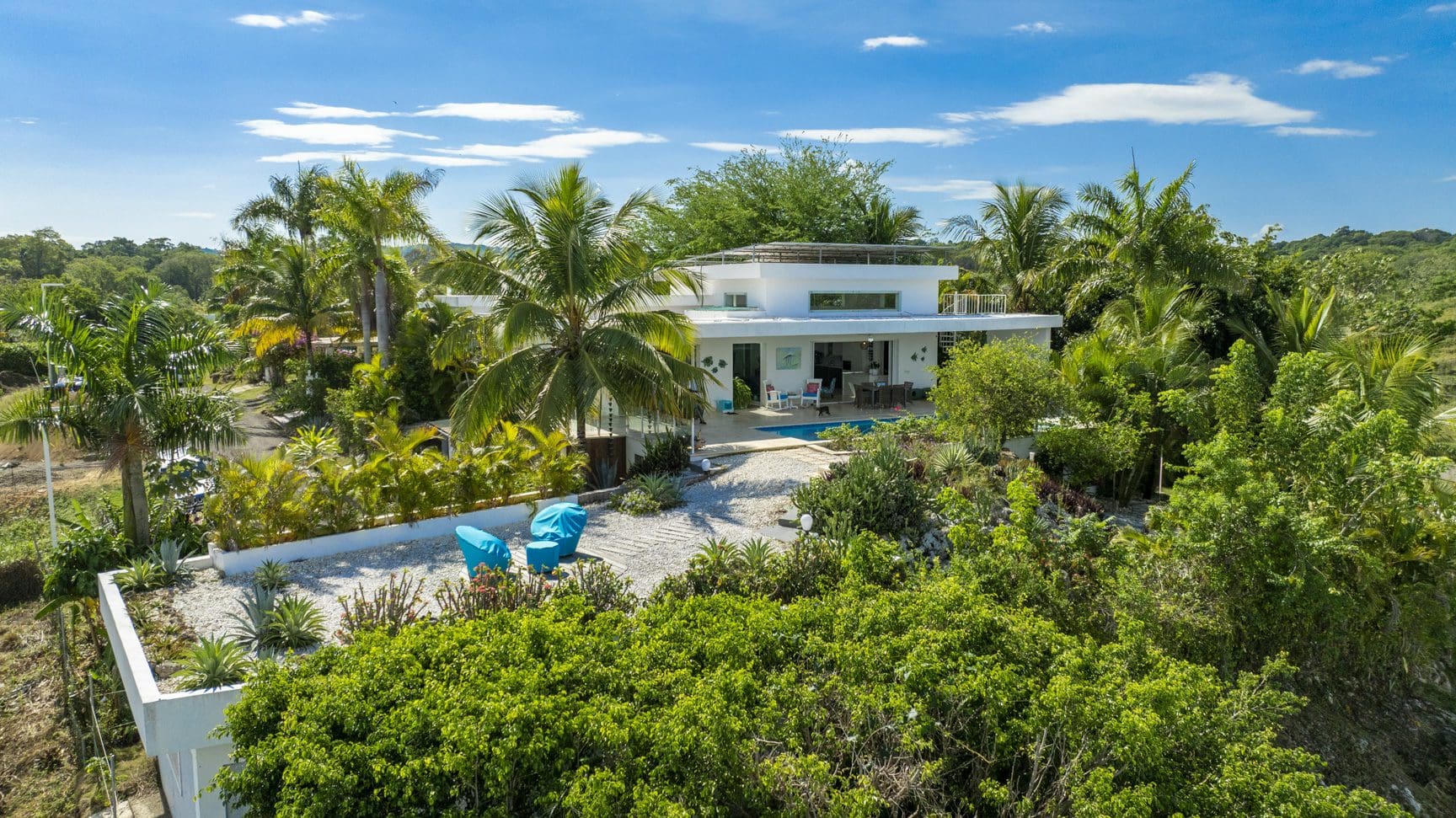 buyDRproperty Luxury villa with pool in Costa Rica, surrounded by tropical foliage. Sosua Real Estate