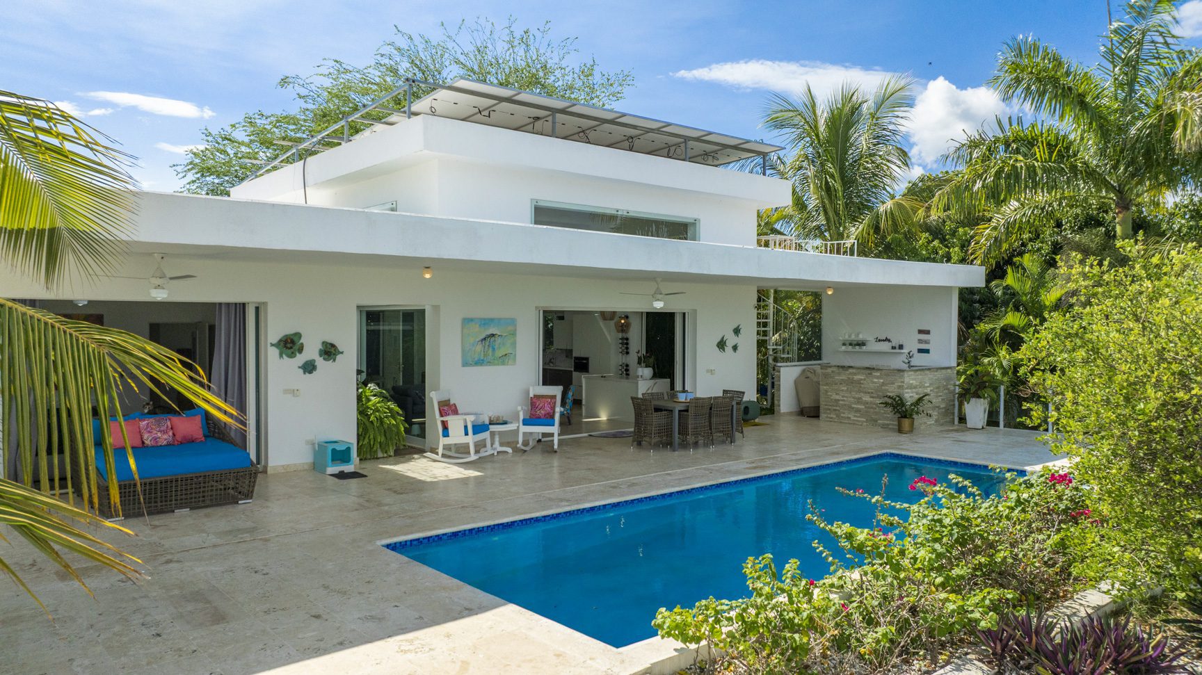 buyDRproperty Costa Rica home with pool and solar panels, promoting sustainable tropical living. Sosua Real Estate