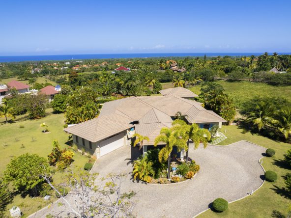 Buydrproperty Spacious Villa with Manicured Lawn and Ocean View Under Clear Blue Sky Sosua Real Estate Buydrpropertycom Buydrpropertycom