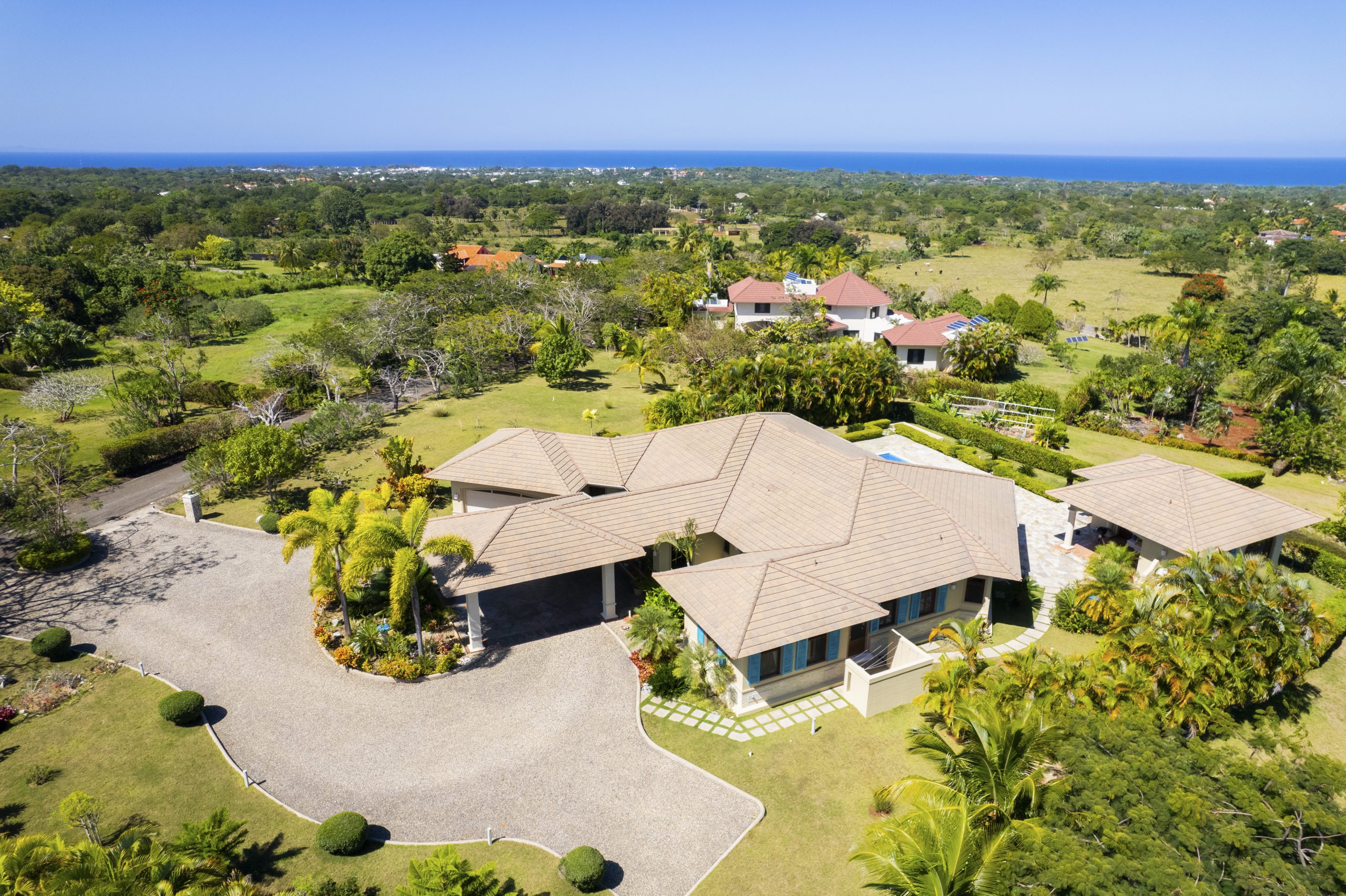 buyDRproperty Luxury villa with pool surrounded by greenery near the ocean Sosua Real Estate