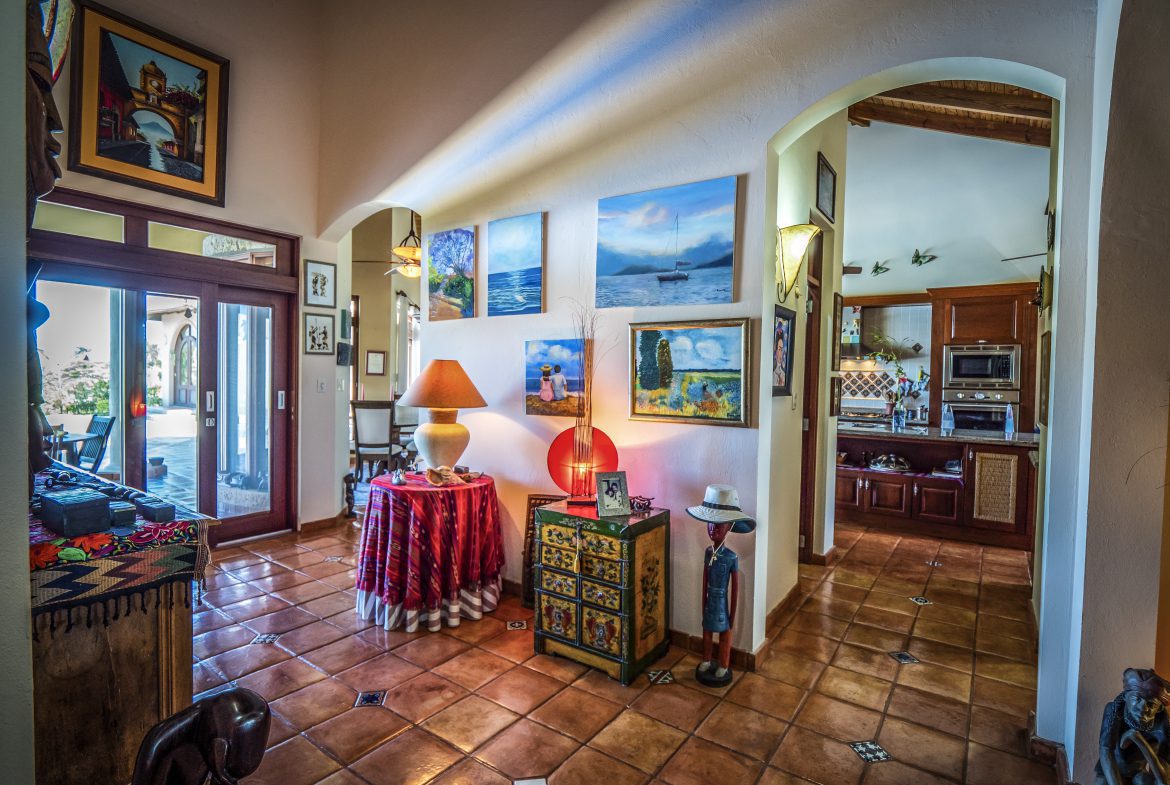 buyDRproperty Colorful interior hallway with art and vibrant lighting Sosua Real Estate