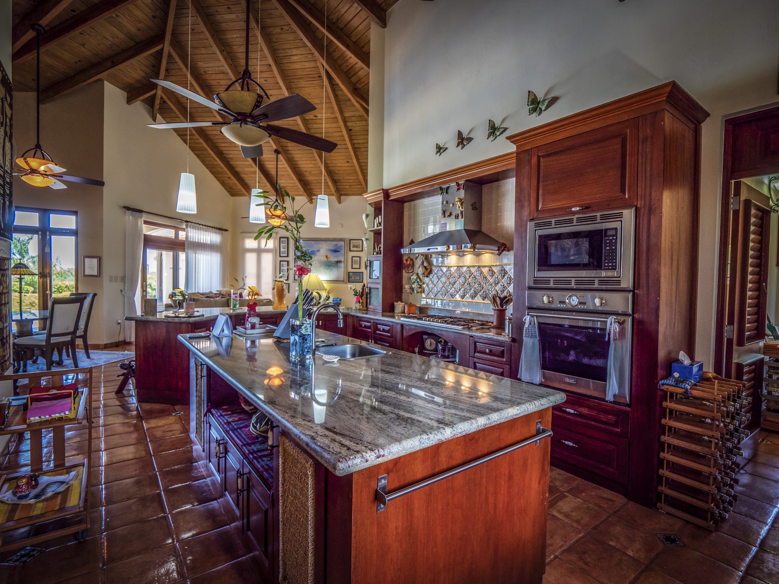 buyDRproperty Rustic kitchen with wooden cabinets and high ceilings Sosua Real Estate
