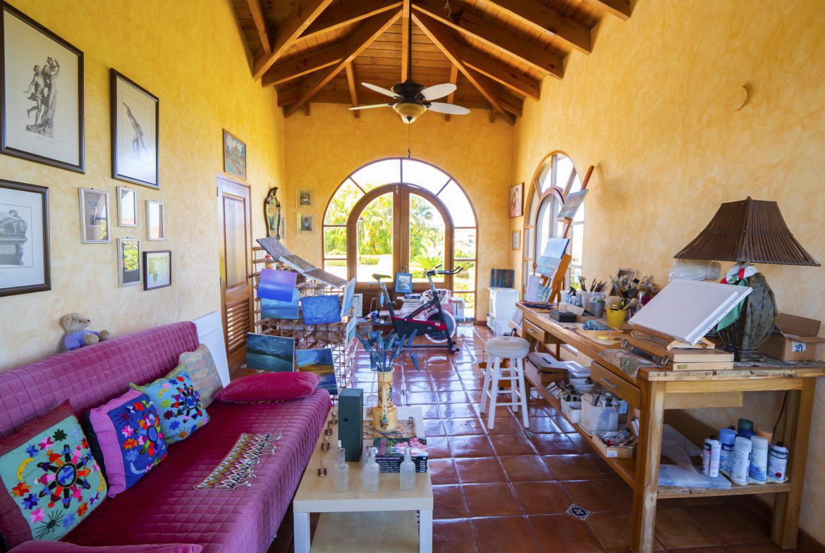 buyDRproperty Colorful art studio with arched windows and vibrant decor Sosua Real Estate