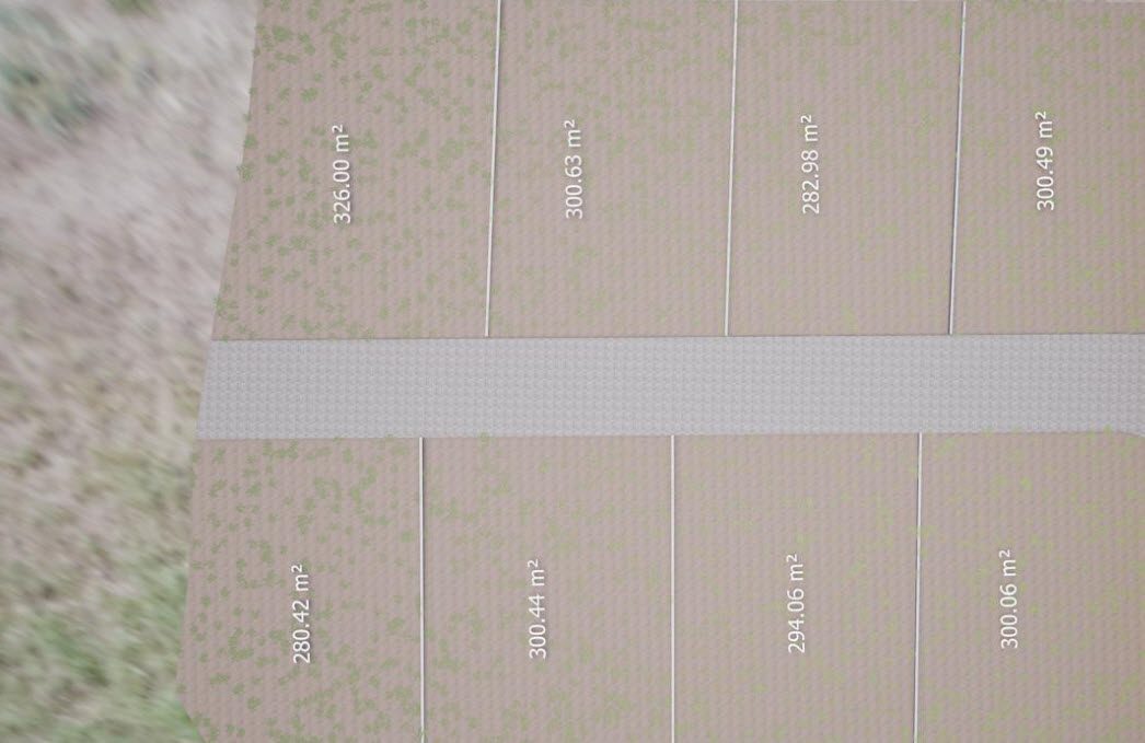 buyDRproperty Aerial view of land plots for sale, ranging from 280 to 326 square meters. Sosua Real Estate