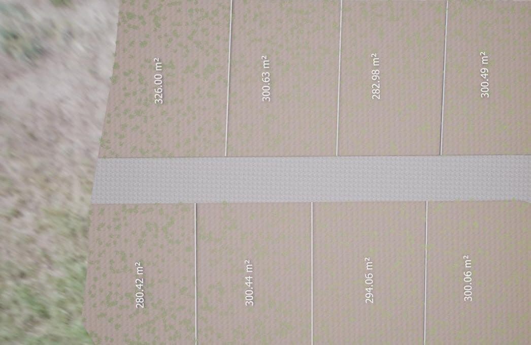 buyDRproperty Aerial view of land plots for sale, ranging from 280 to 326 square meters. Sosua Real Estate