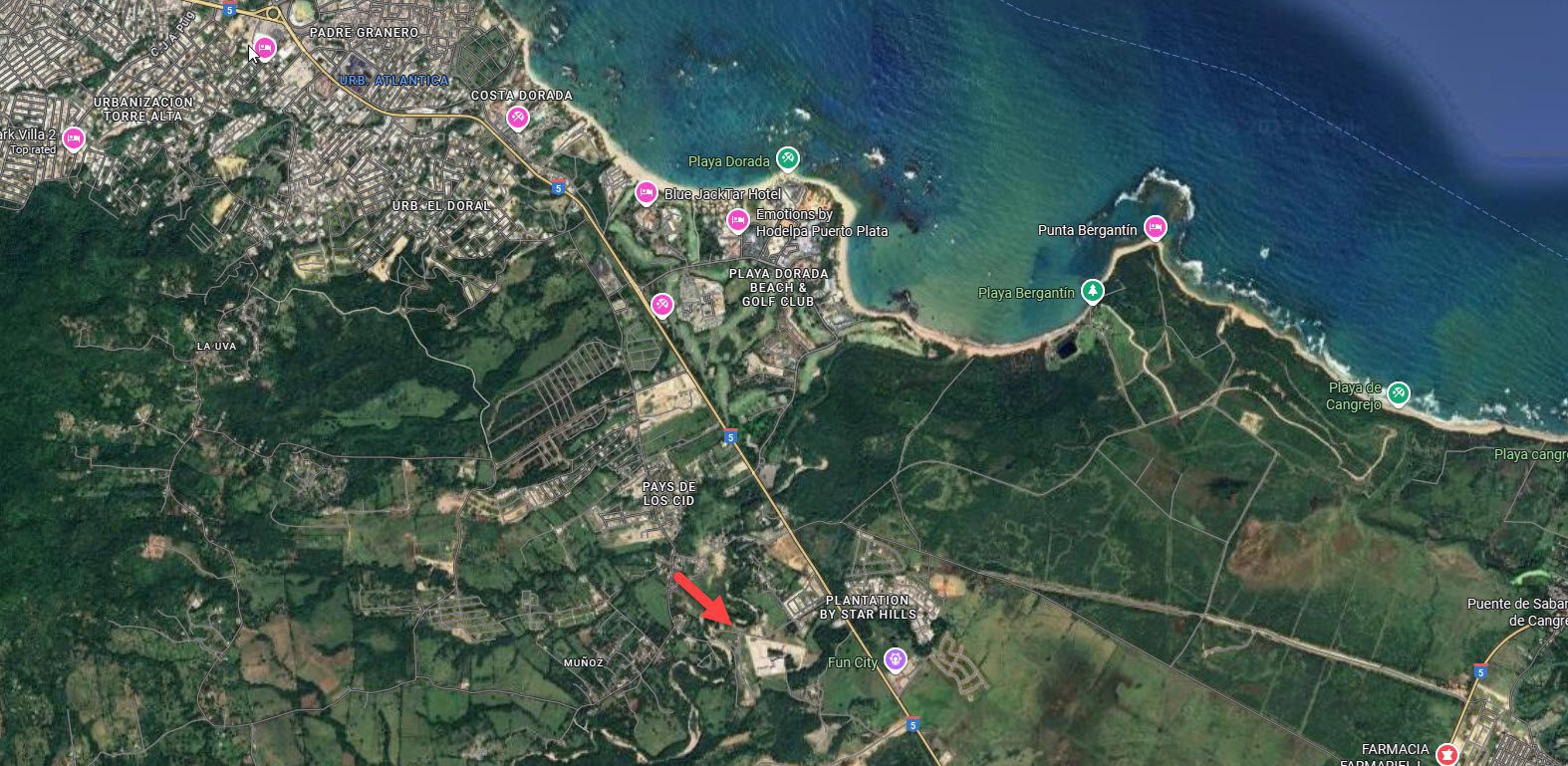 buyDRproperty Aerial view of Playa Dorada, Dominican Republic, featuring beaches, resorts, and golf courses along the coastline. Sosua Real Estate