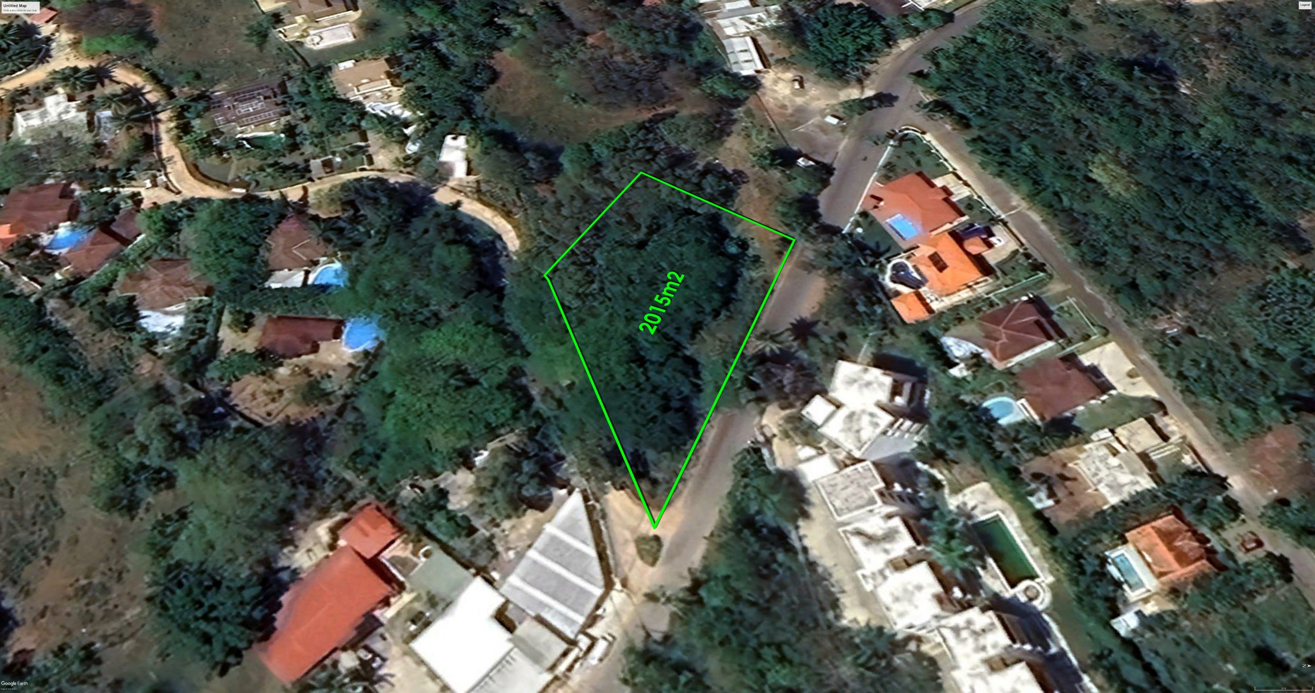 Buydrproperty Aerial View of a 2015m2 Building Lot for Sale in La Mulata Sosua Surrounded by Lush Greenery and Houses Sosua Real Estate Buydrpropertycom Buydrpropertycom