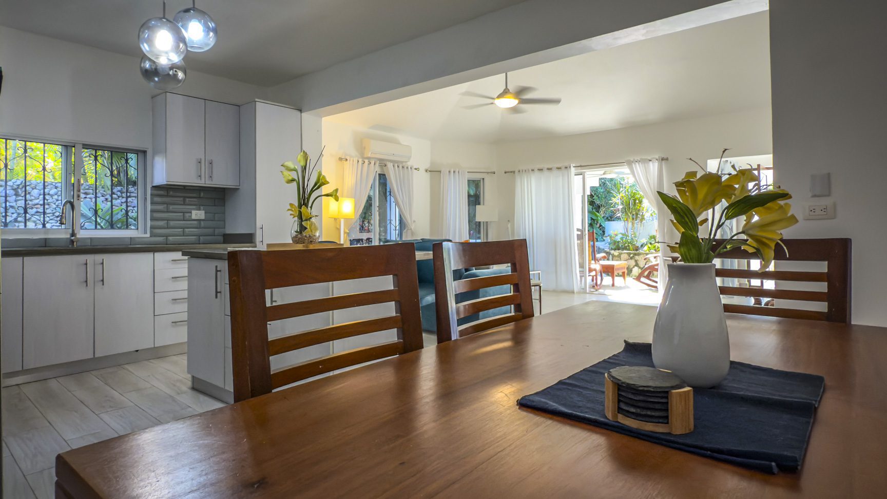 buyDRproperty Bright, open-plan kitchen and dining area with a view to the patio. Sosua Real Estate