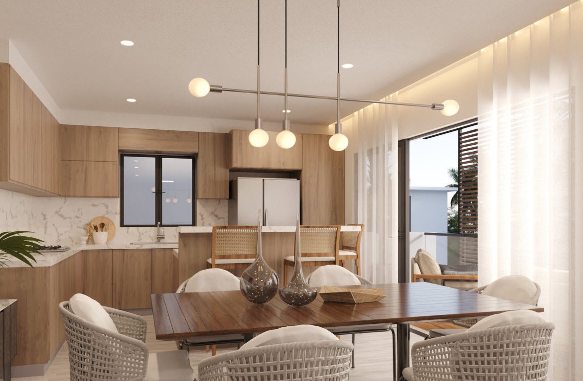 buyDRproperty Modern dining room with wood table and woven chairs, bright and airy. Sosua Real Estate
