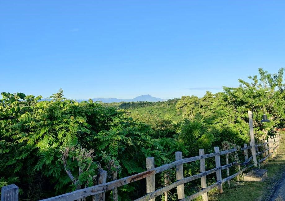 Buydrproperty Lush Green Landscape with Distant Mountains Viewed from Panorama Village Ocean view Lot Available Sosua Real Estate Buydrpropertycom Buydrpropertycom