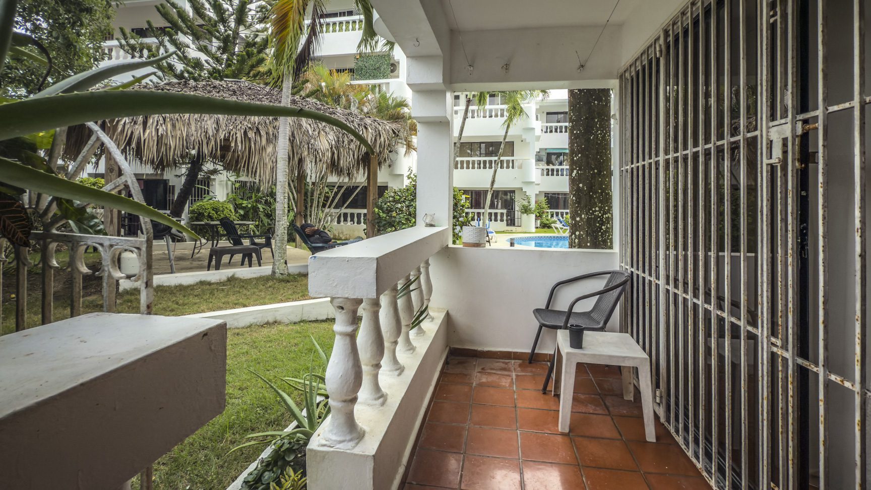 buyDRproperty Sosúa condo balcony view with pool and playa access. Sosua Real Estate