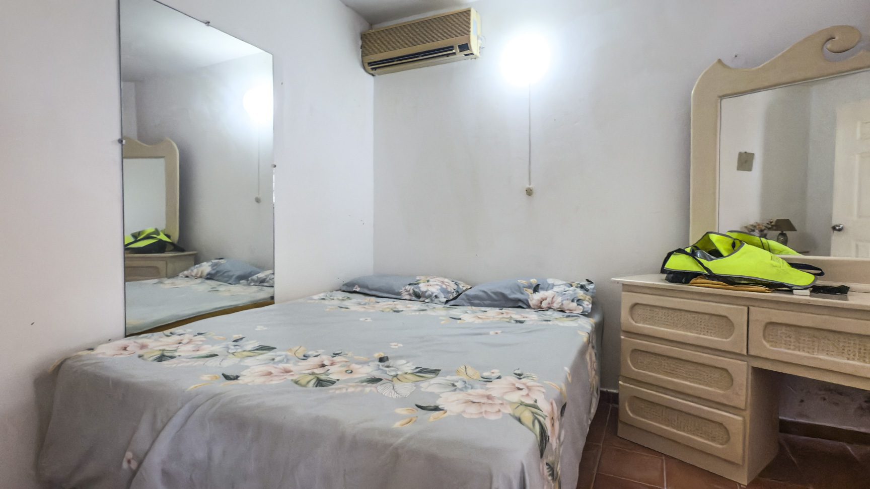 buyDRproperty Bedroom in Sosúa with bed, dresser, and mirror. Great value playa condo. Sosua Real Estate