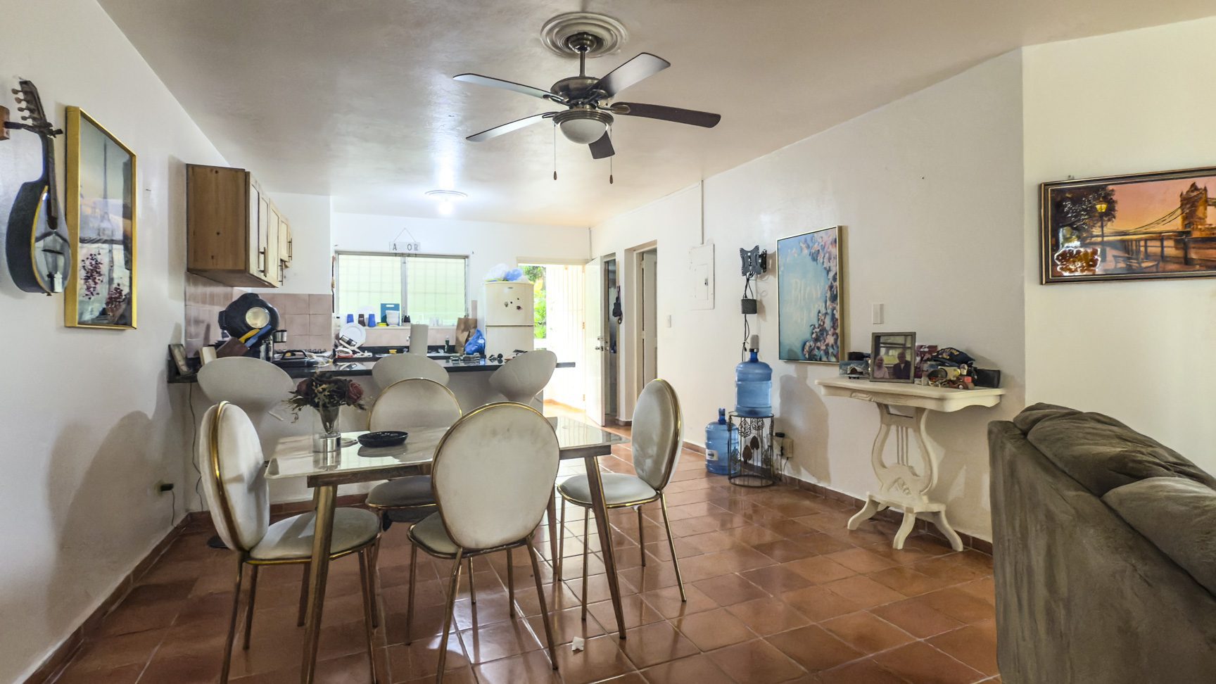 buyDRproperty Sosúa home interior: Dining area, kitchen, and living space with tile floors. Great value near playa! Sosua Real Estate
