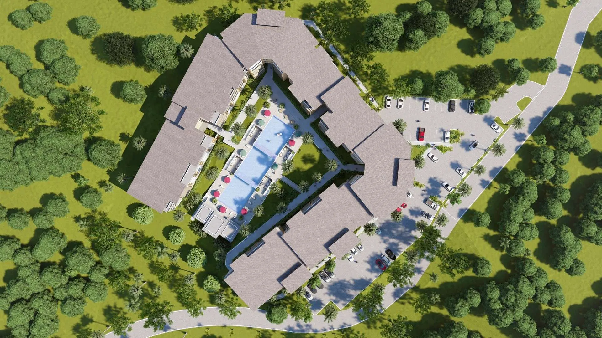 buyDRproperty Aerial view of a resort with a central pool, surrounding buildings, parking area, and lush green landscaping. Sosua Real Estate