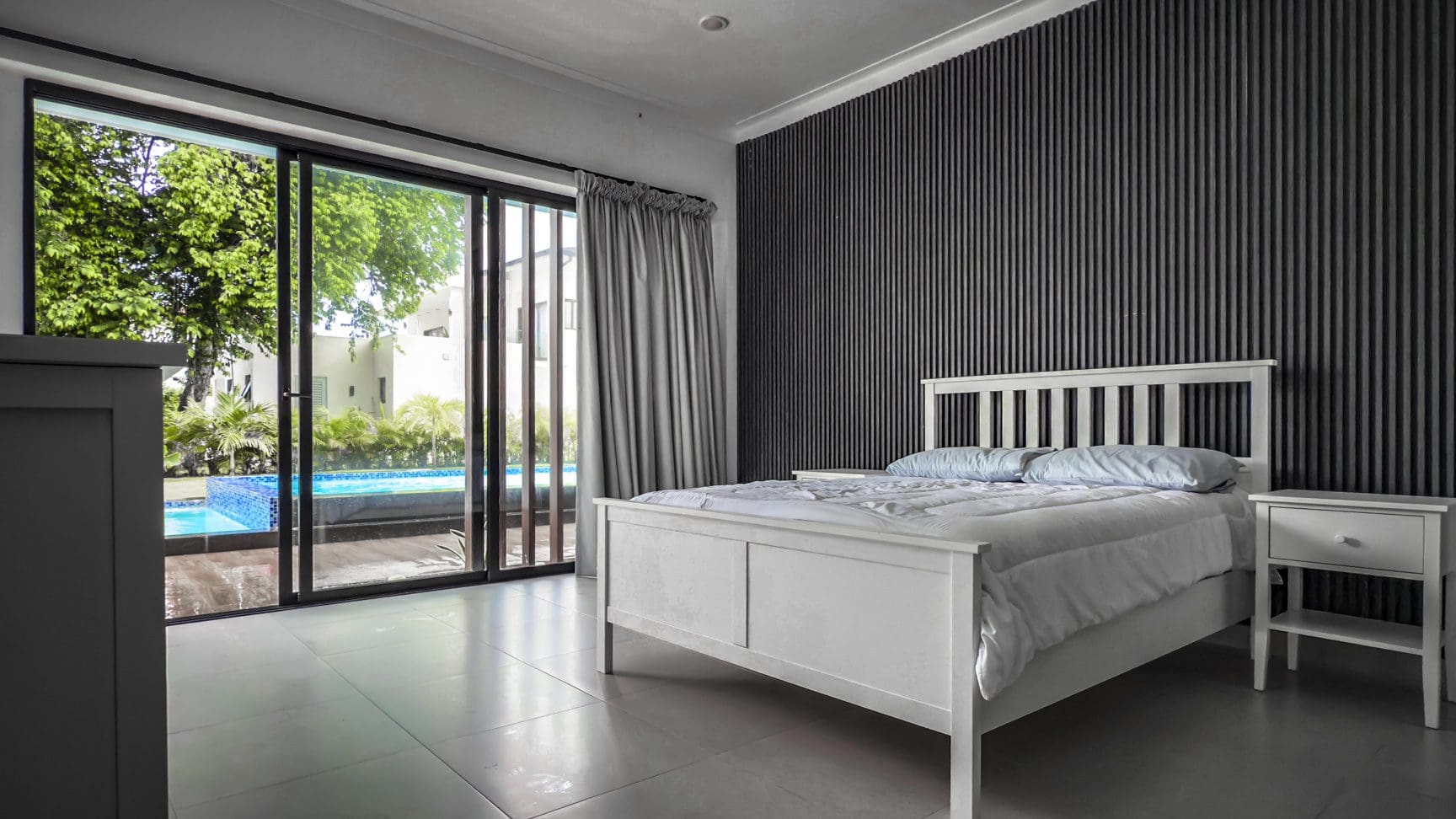 buyDRproperty Luxury villa bedroom with pool view, Sosua Ocean Village. Sosua Real Estate