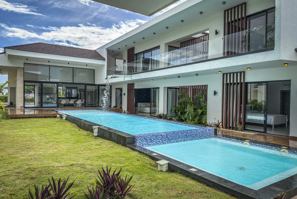buyDRproperty Luxury villa with a modern design and a tiered swimming pool. Sosua Real Estate