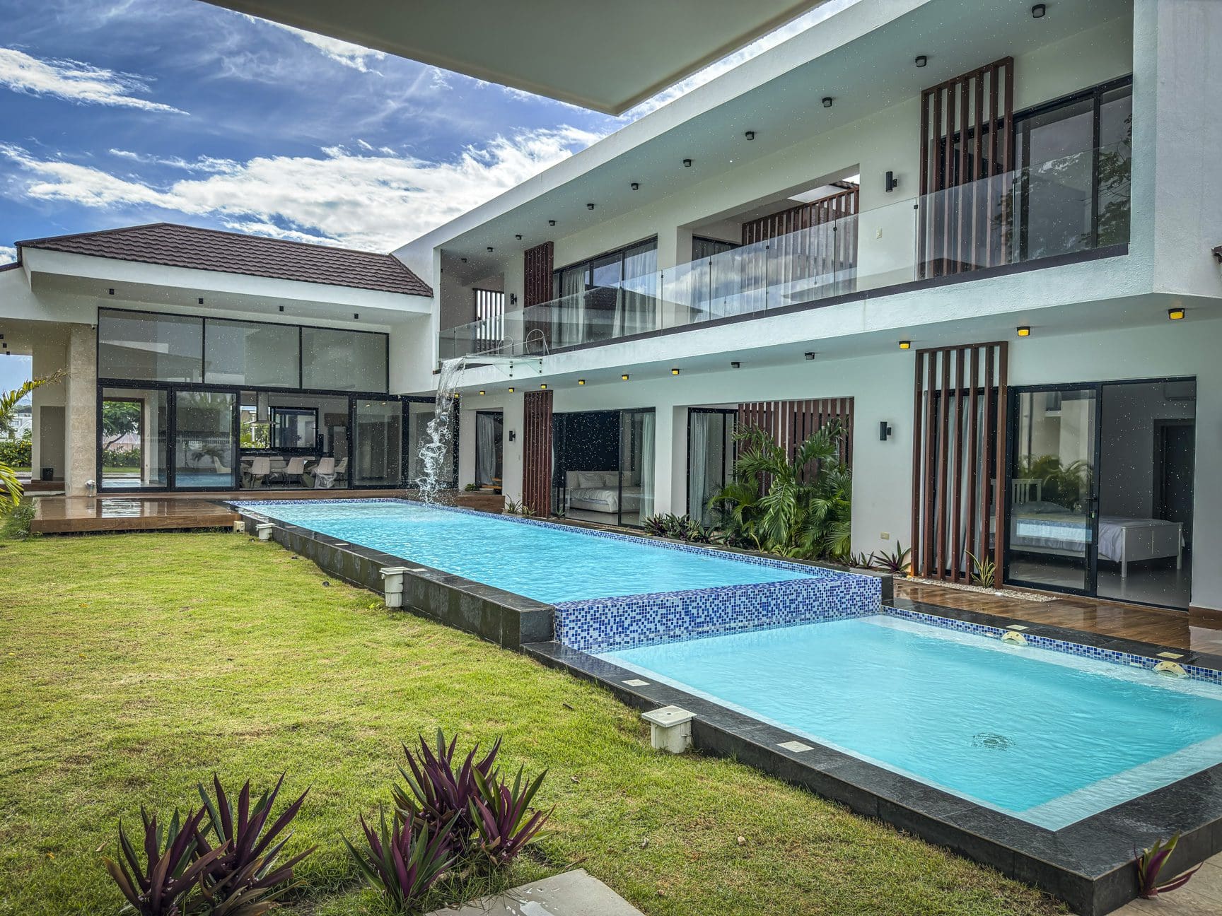 buyDRproperty Luxury villa with a modern design and a tiered swimming pool. Sosua Real Estate