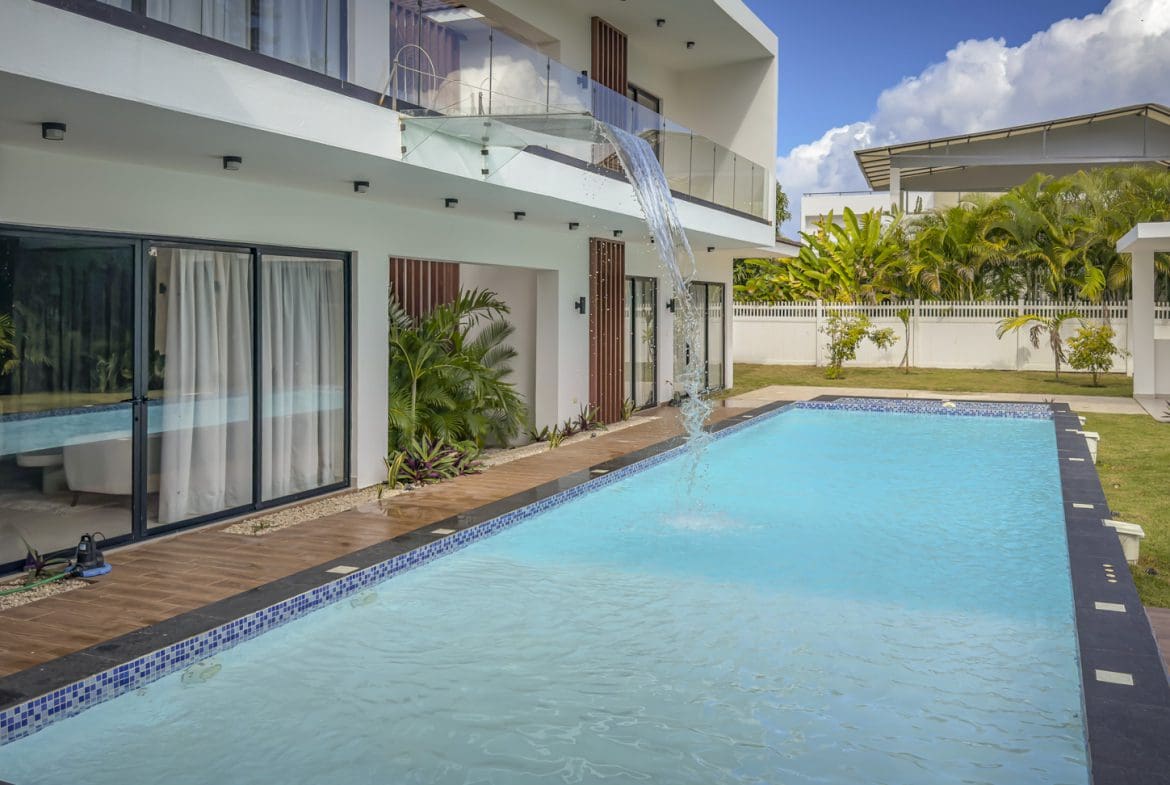 buyDRproperty Luxury villa with pool and waterfall feature in Sosua Ocean Village. Sosua Real Estate