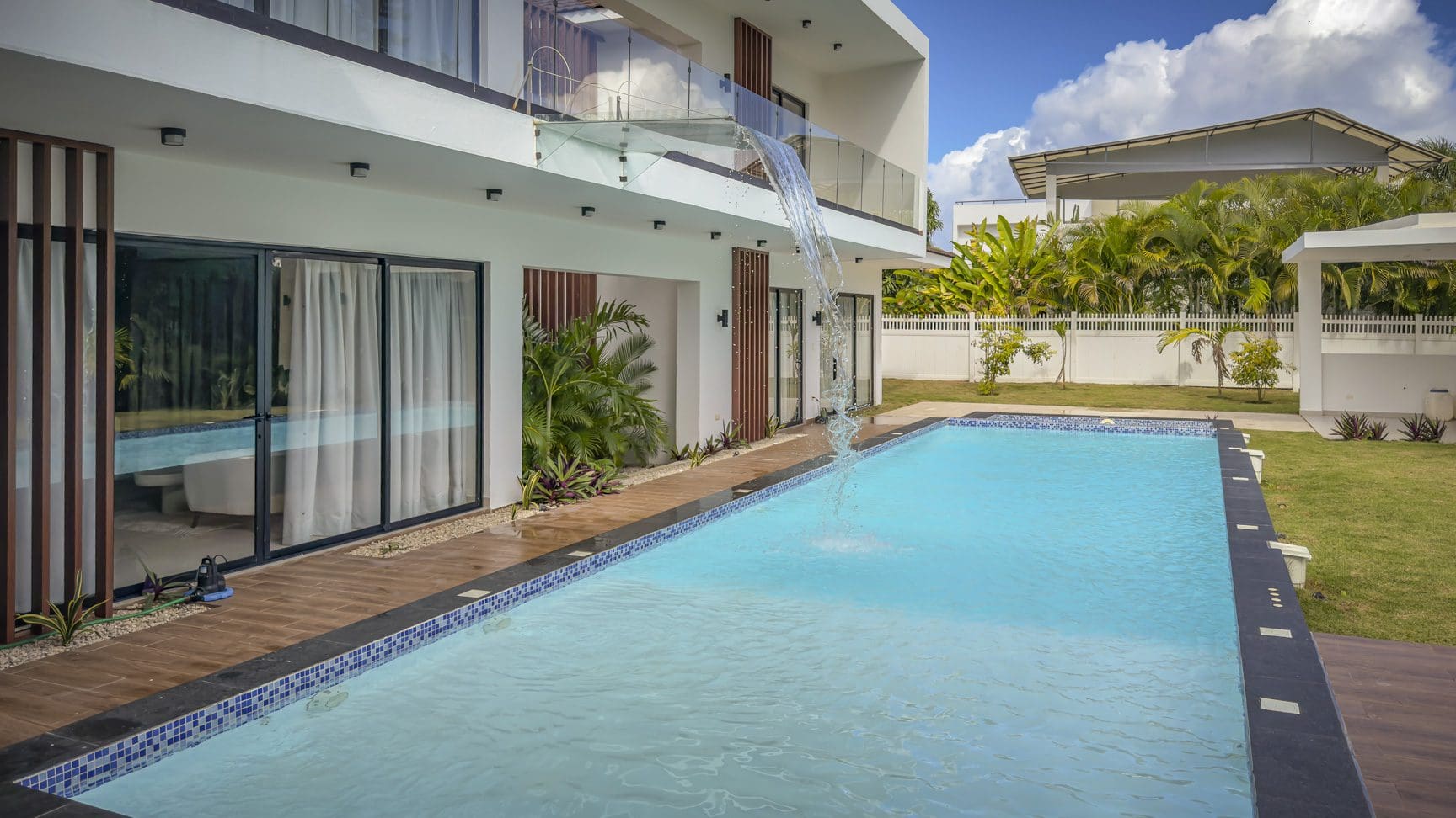 buyDRproperty Luxury villa with pool and waterfall feature in Sosua Ocean Village. Sosua Real Estate