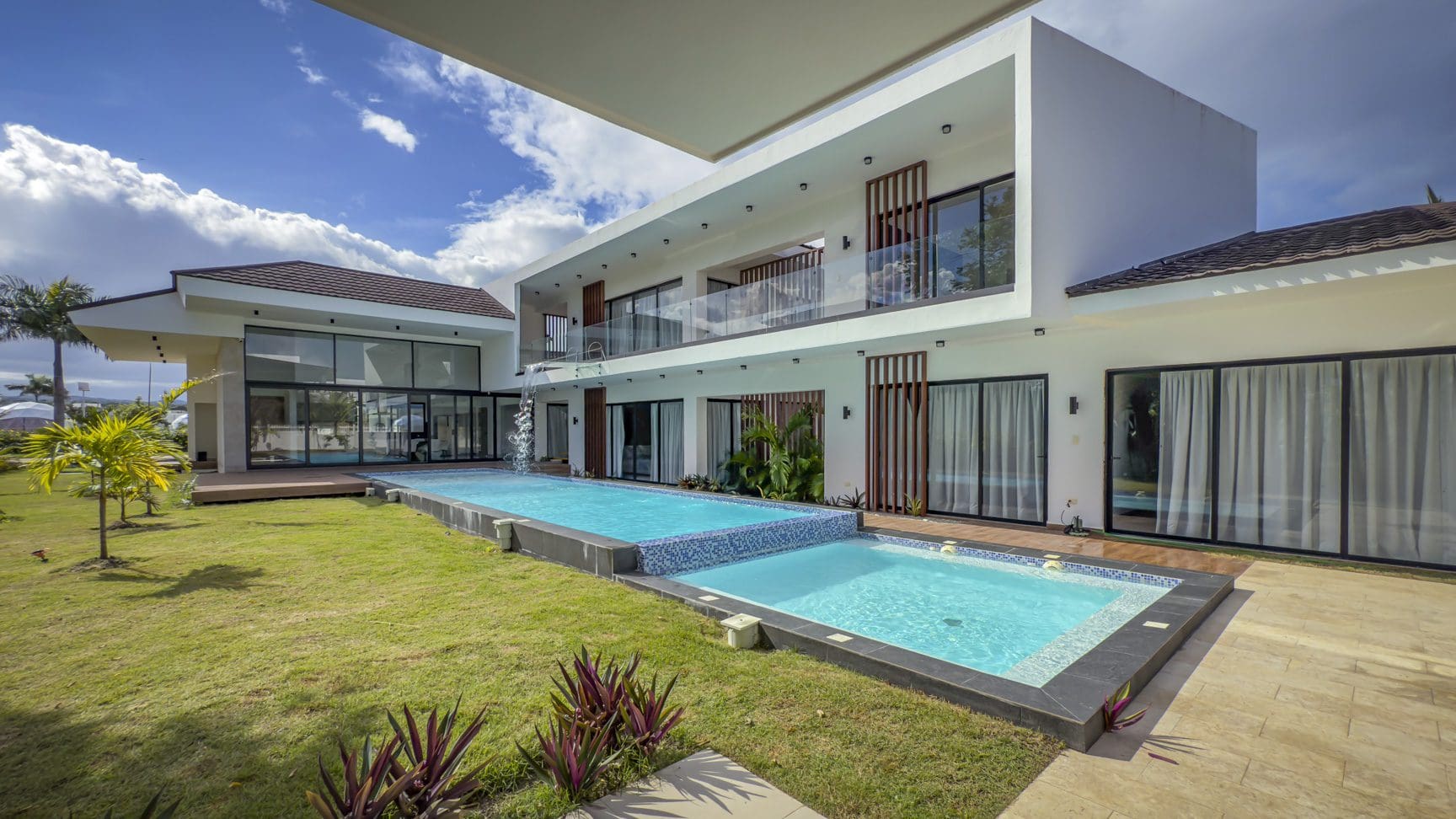 buyDRproperty Luxury villa with pool in Sosua Ocean Village. Modern, two-story architecture. Sosua Real Estate