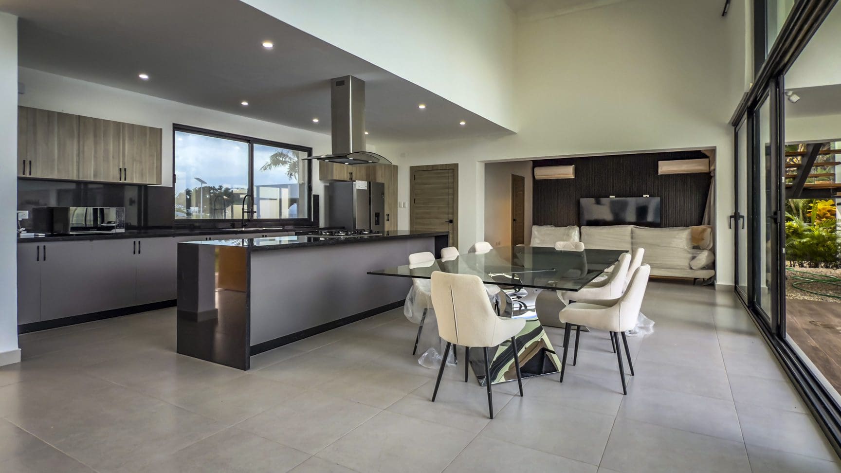 buyDRproperty Modern kitchen and dining area in a luxury villa. Sosua Real Estate