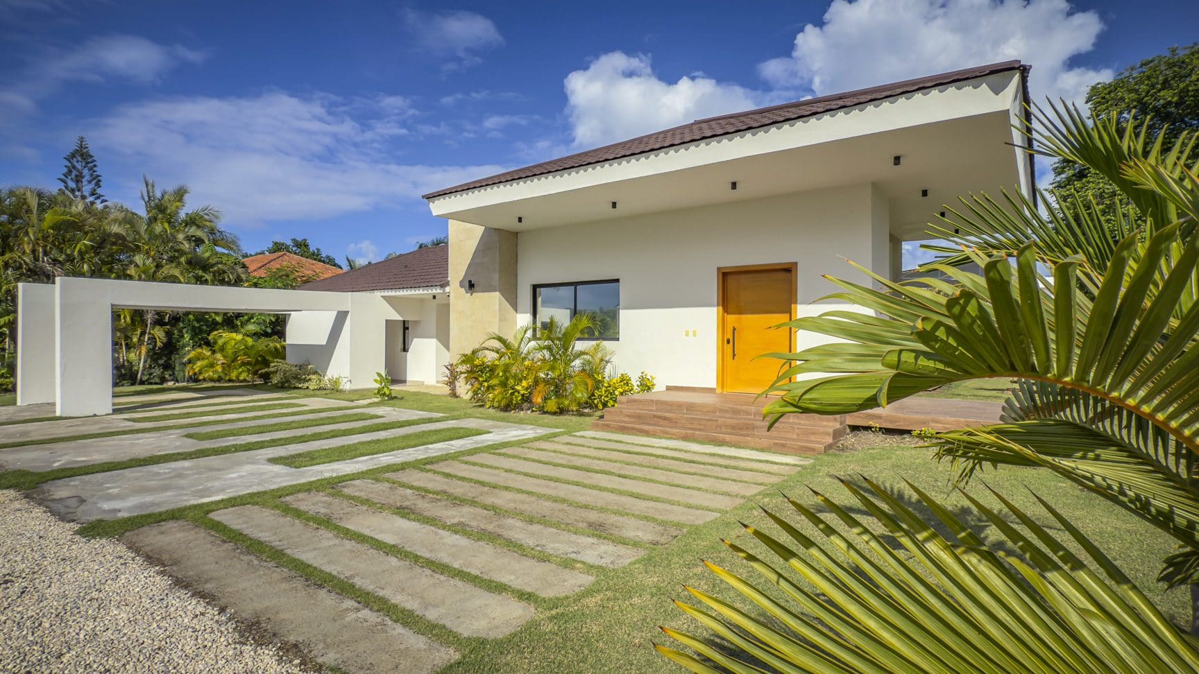 buyDRproperty Modern luxury villa with a unique driveway design in Sosua Ocean Village. Sosua Real Estate