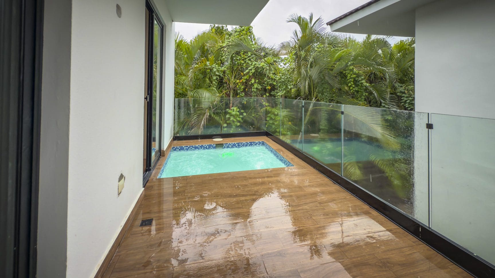 buyDRproperty Luxury villa balcony with small private pool and lush tropical greenery. Sosua Real Estate