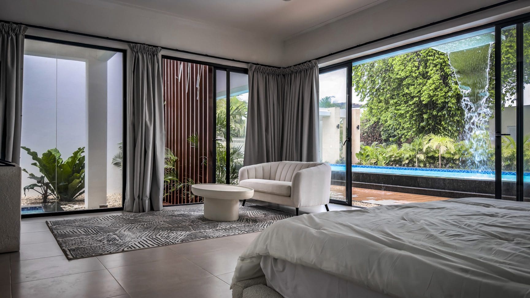 buyDRproperty Luxury villa bedroom with pool view in Sosua Ocean Village Sosua Real Estate