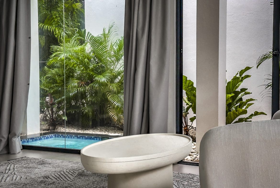 buyDRproperty Luxury villa interior with pool view in Sosua Ocean Village. Sosua Real Estate