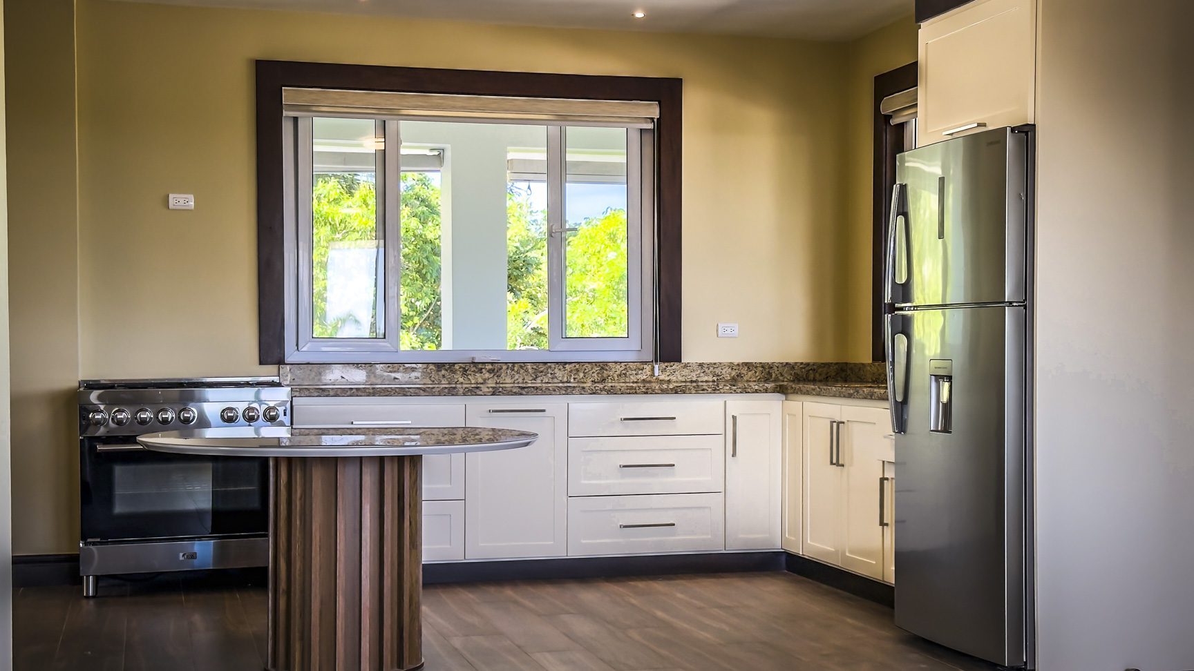 buyDRproperty Bright kitchen in 3-bedroom villa for sale in La Mulata, Dominican Republic. Features stainless steel appliances and granite countertops. Sosua Real Estate