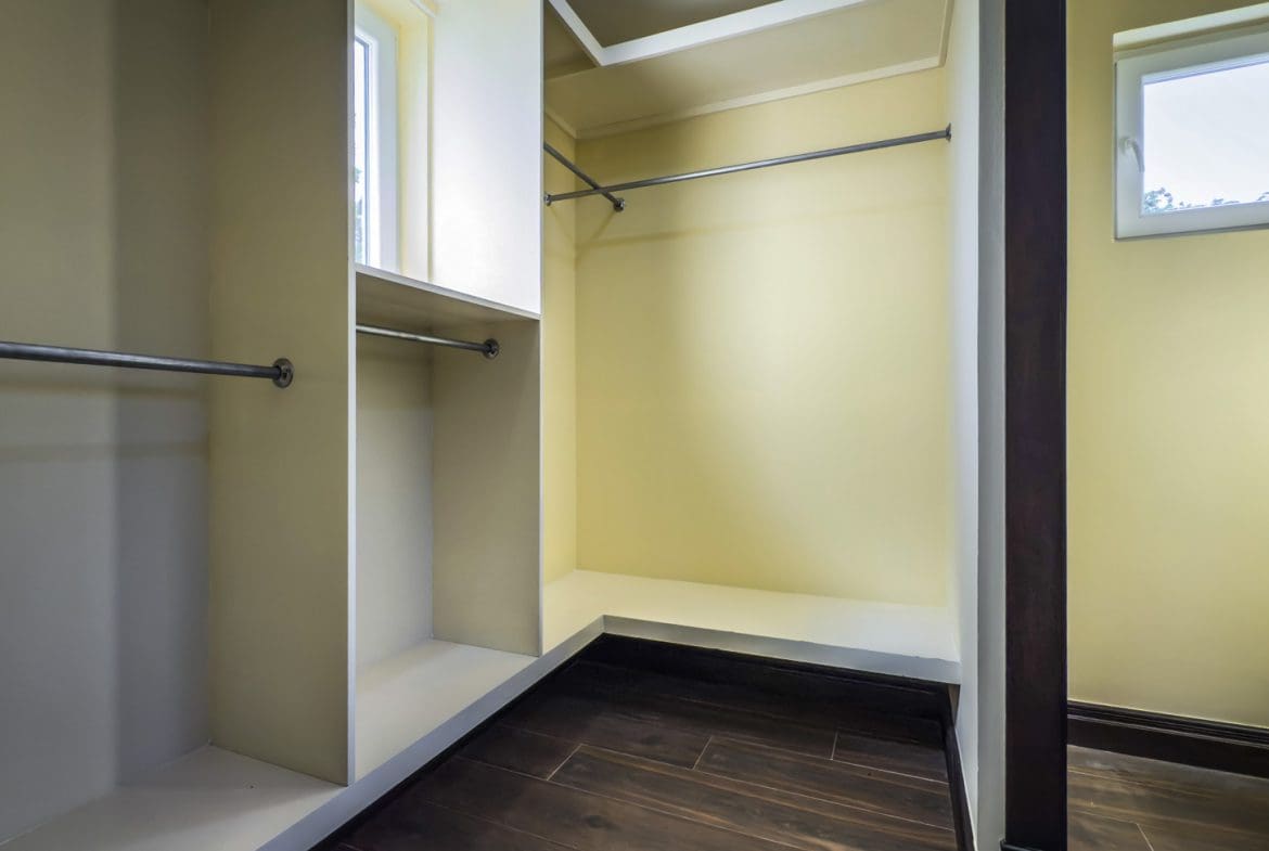 buyDRproperty Walk-in closet with hanging rods and shelves, part of a 3-bedroom villa for sale. Sosua Real Estate