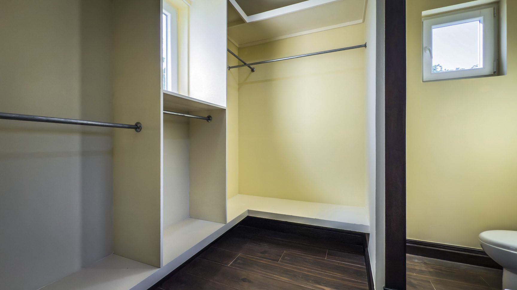 buyDRproperty Walk-in closet with hanging rods and shelves, part of a 3-bedroom villa for sale. Sosua Real Estate