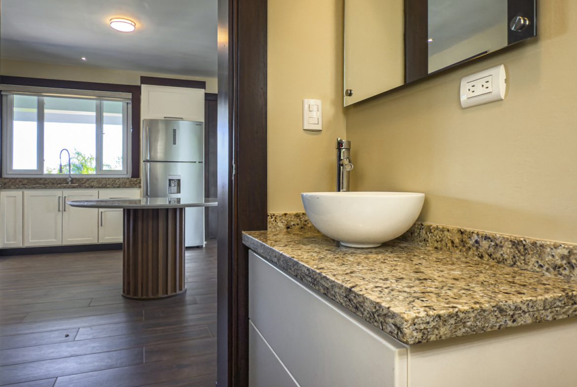 buyDRproperty Modern bathroom with granite countertop and vessel sink, part of a 3 bedroom villa for sale in La Mulata. Sosua Real Estate