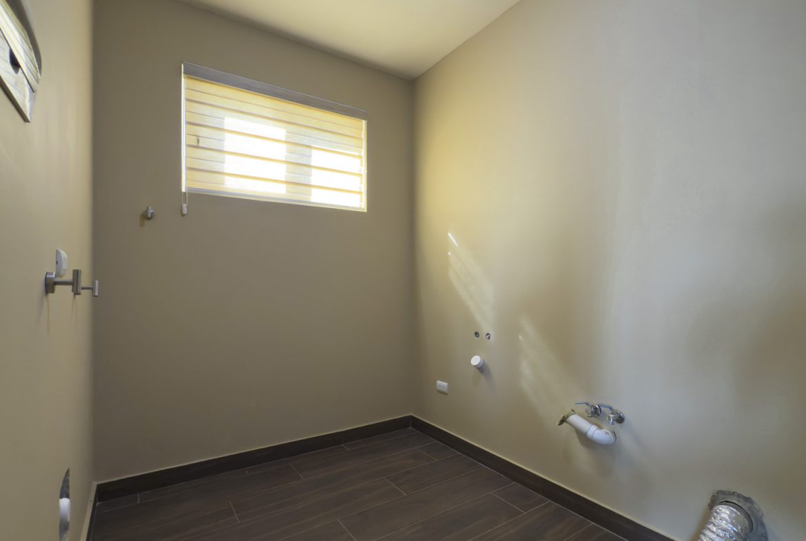 buyDRproperty Empty laundry room with window, tile floor, and utility connections. Villa in La Mulata. Sosua Real Estate