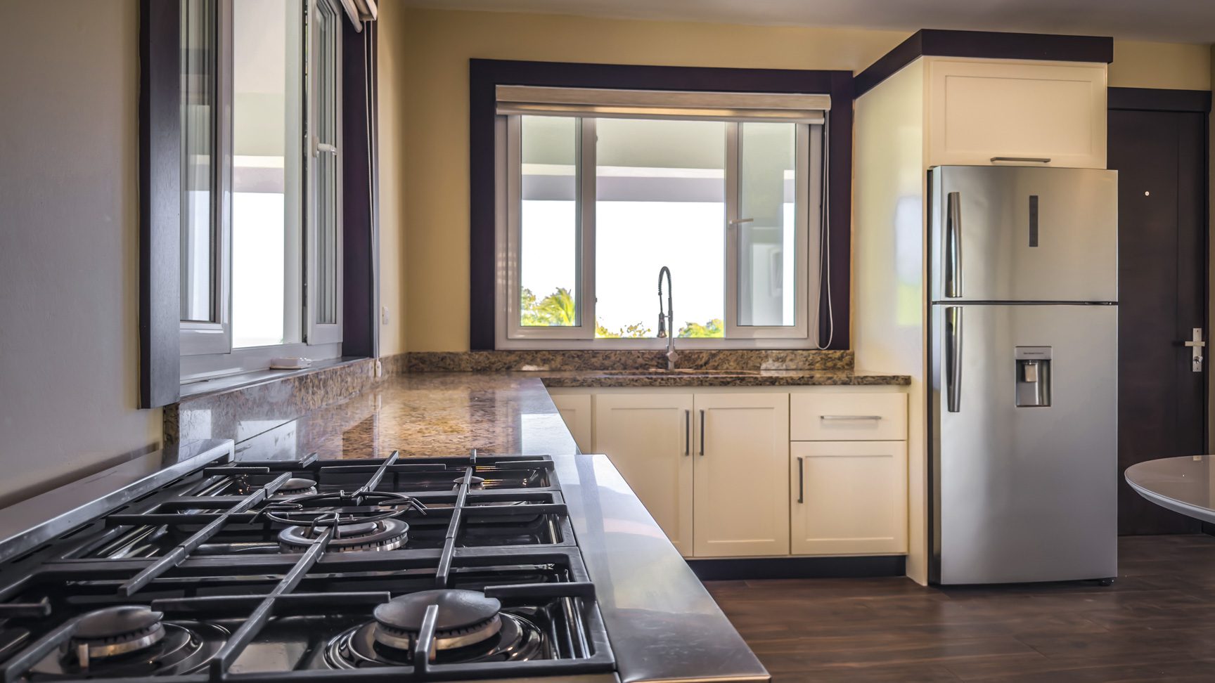 buyDRproperty Modern kitchen with stainless steel appliances in La Mulata villa. Sosua Real Estate