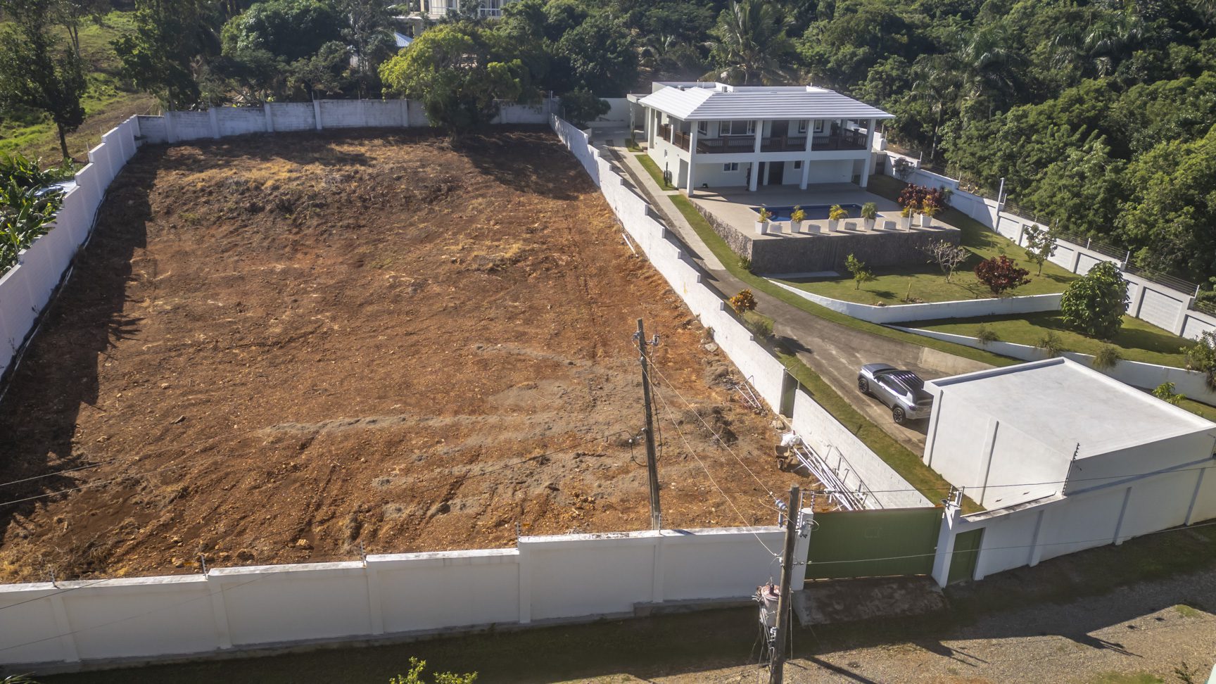 buyDRproperty La Mulata villa for sale with pool and vacant lot. Gated property. Sosua Real Estate