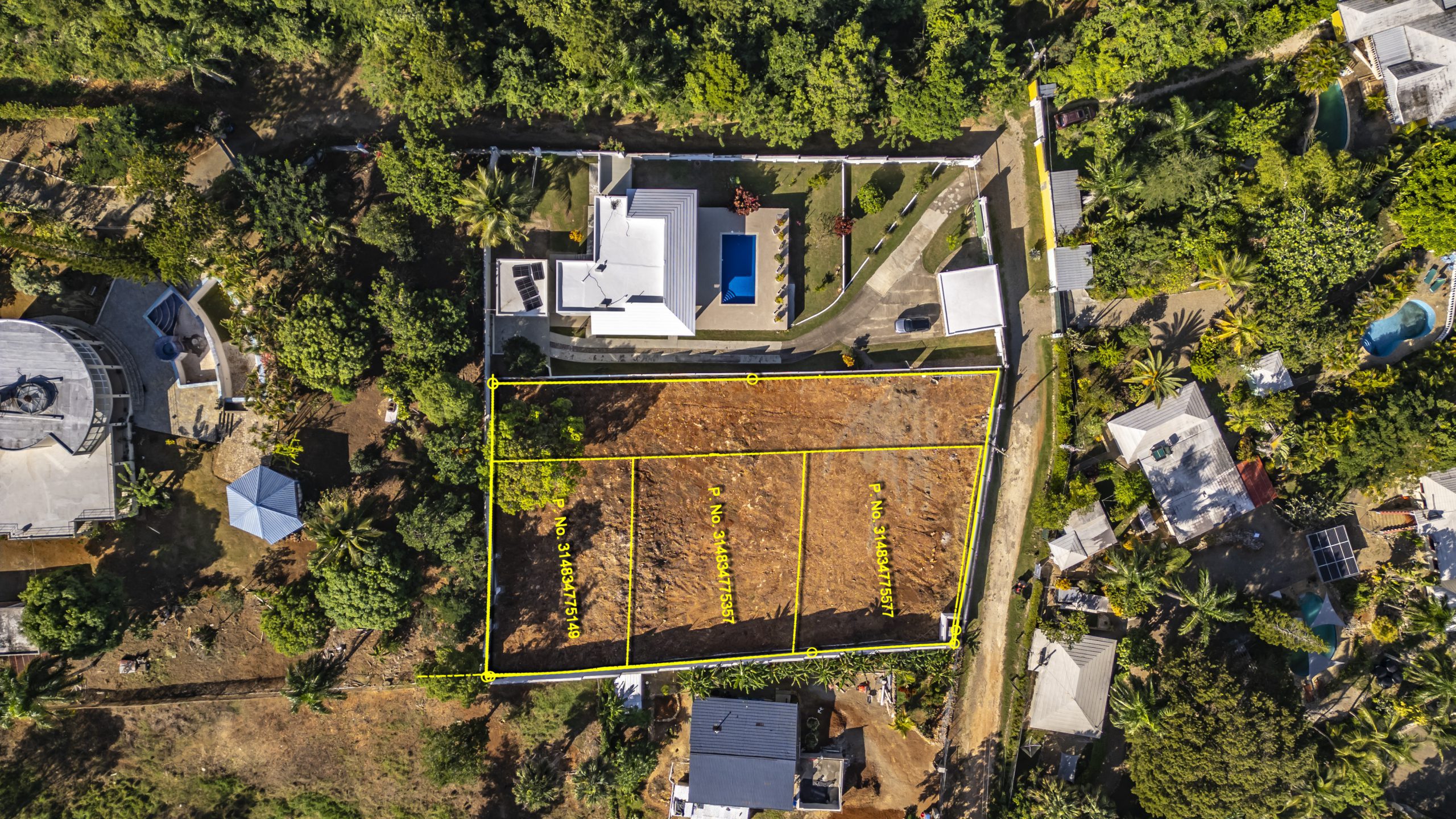 buyDRproperty Aerial view of La Mulata villa property for sale, showing land plot with marked boundaries. Sosua Real Estate