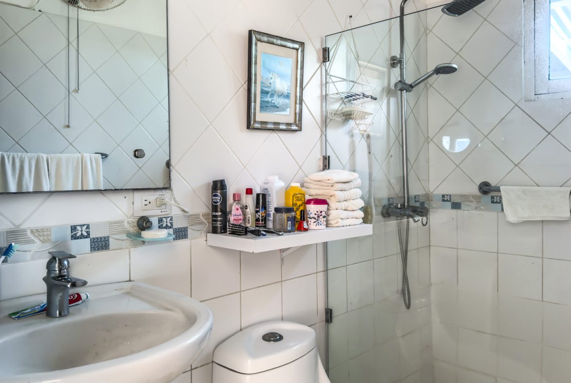 buyDRproperty Bathroom of villa with sink, shower, and toiletries. Sosua Real Estate