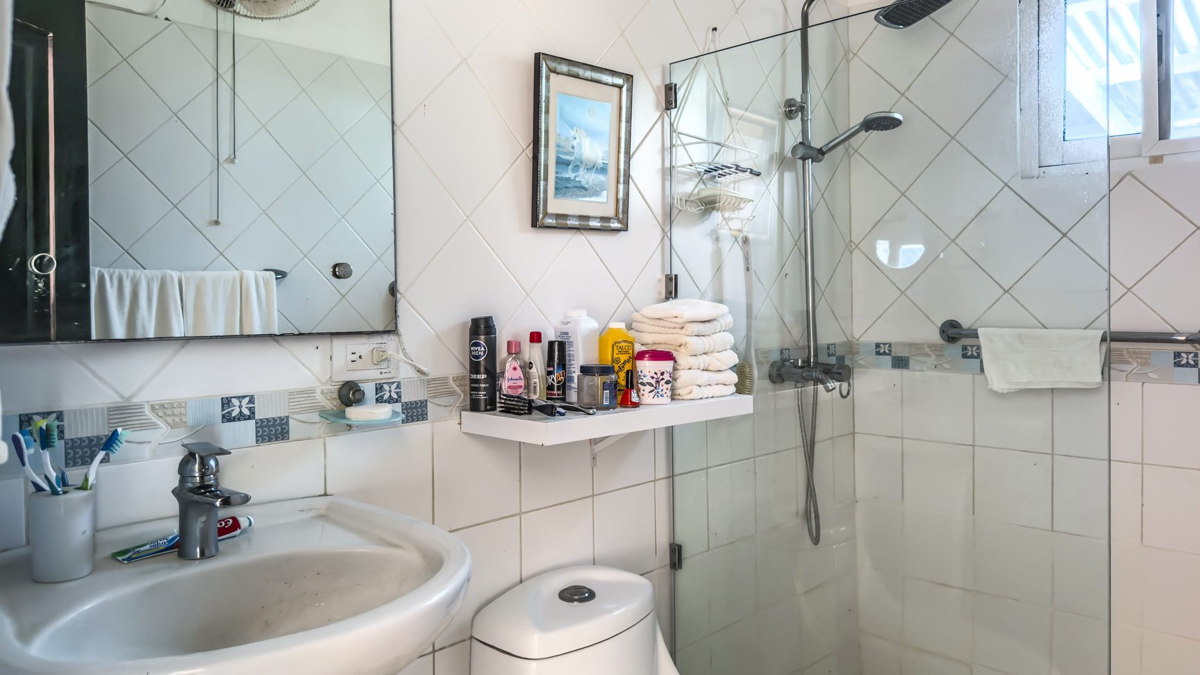 buyDRproperty Bathroom of villa with sink, shower, and toiletries. Sosua Real Estate