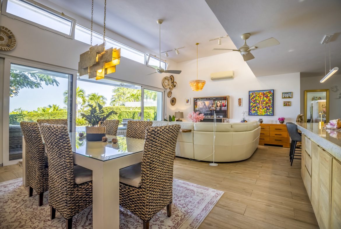 buyDRproperty Open-plan living and dining area with modern decor and ample natural light. Sosua Real Estate