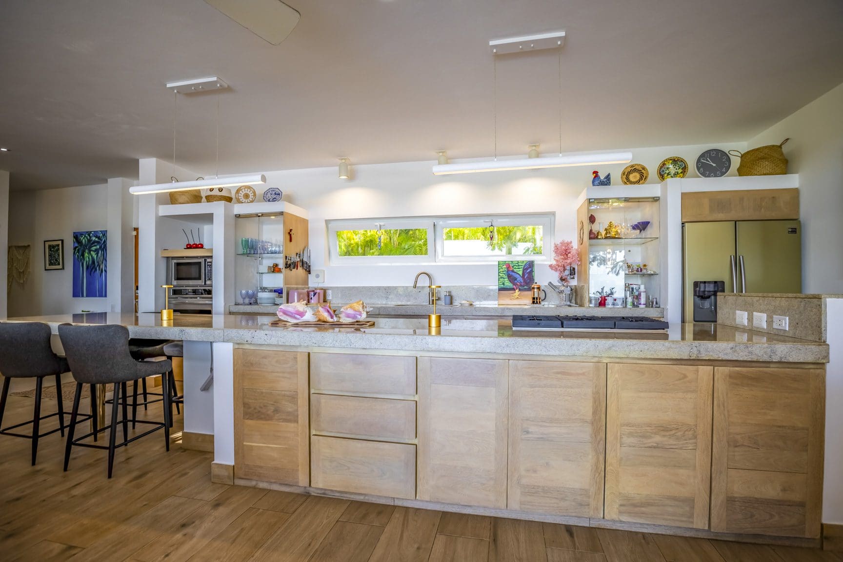 buyDRproperty Modern kitchen with stainless steel appliances and a granite countertop Sosua Real Estate