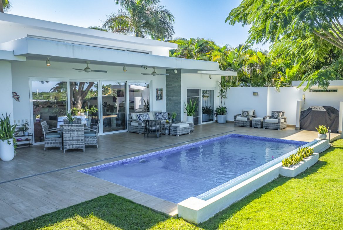 buyDRproperty Luxury villa with pool and outdoor living space in tropical setting. Sosua Real Estate
