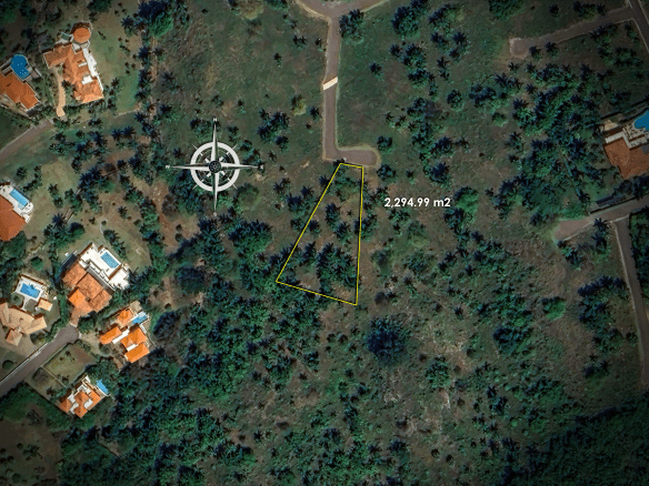 buyDRproperty Aerial view of a plot of land measuring 2,274.99 square meters with surrounding houses Sosua Real Estate