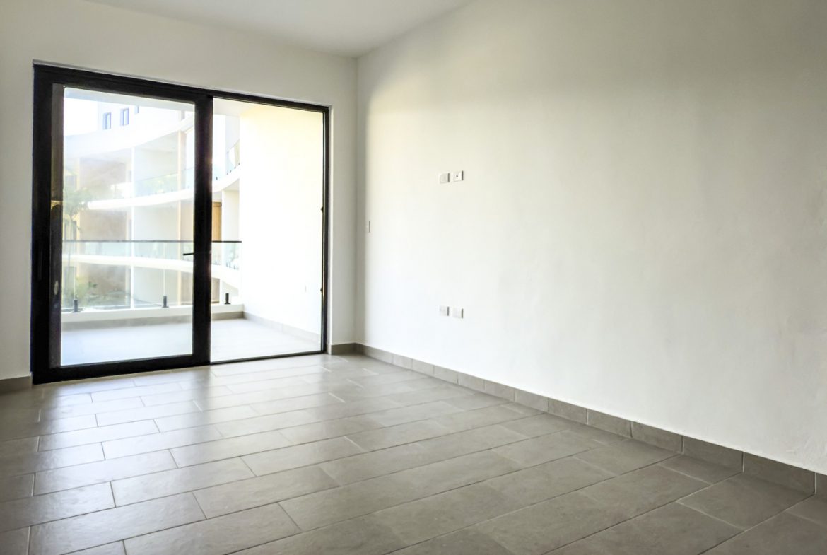 buyDRproperty Spacious empty room with tiled floor and large sliding glass door Sosua Real Estate