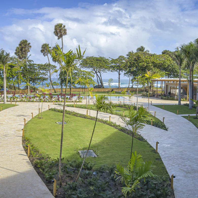 Buydrproperty Luxury Resort Courtyard with Palm Trees Walkways and Ocean View in the Dominican Republic Sosua Real Estate Buydrpropertycom Buydrpropertycom