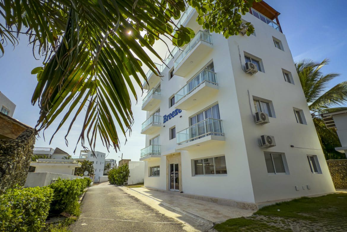 buyDRproperty Exterior of Breeze building with balconies in sunny Dominican Republic Sosua Real Estate