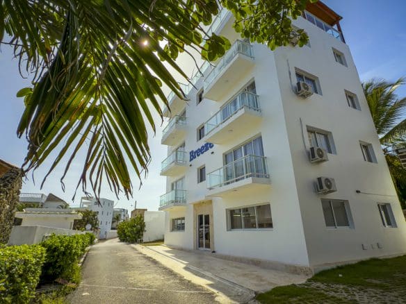buyDRproperty Exterior of Breeze building with balconies in sunny Dominican Republic Sosua Real Estate